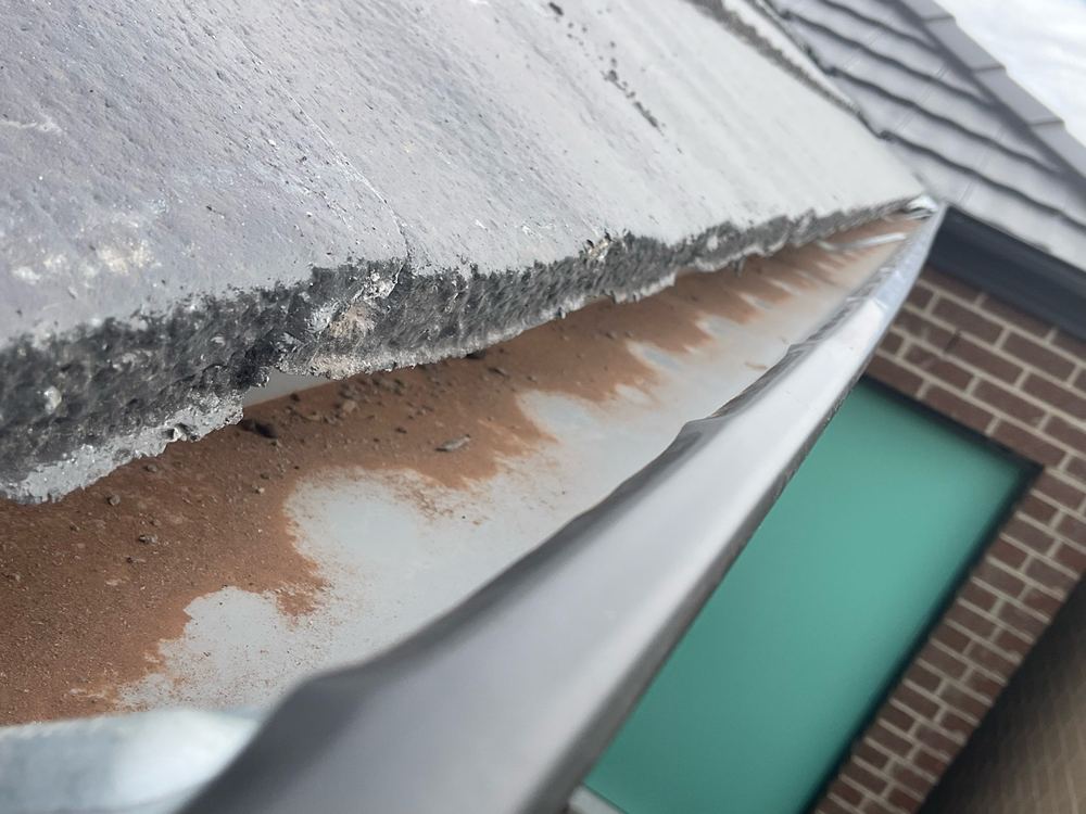 Gutters holding building debris that needs clearing before it blocks the outlets, Aintree, Deanside