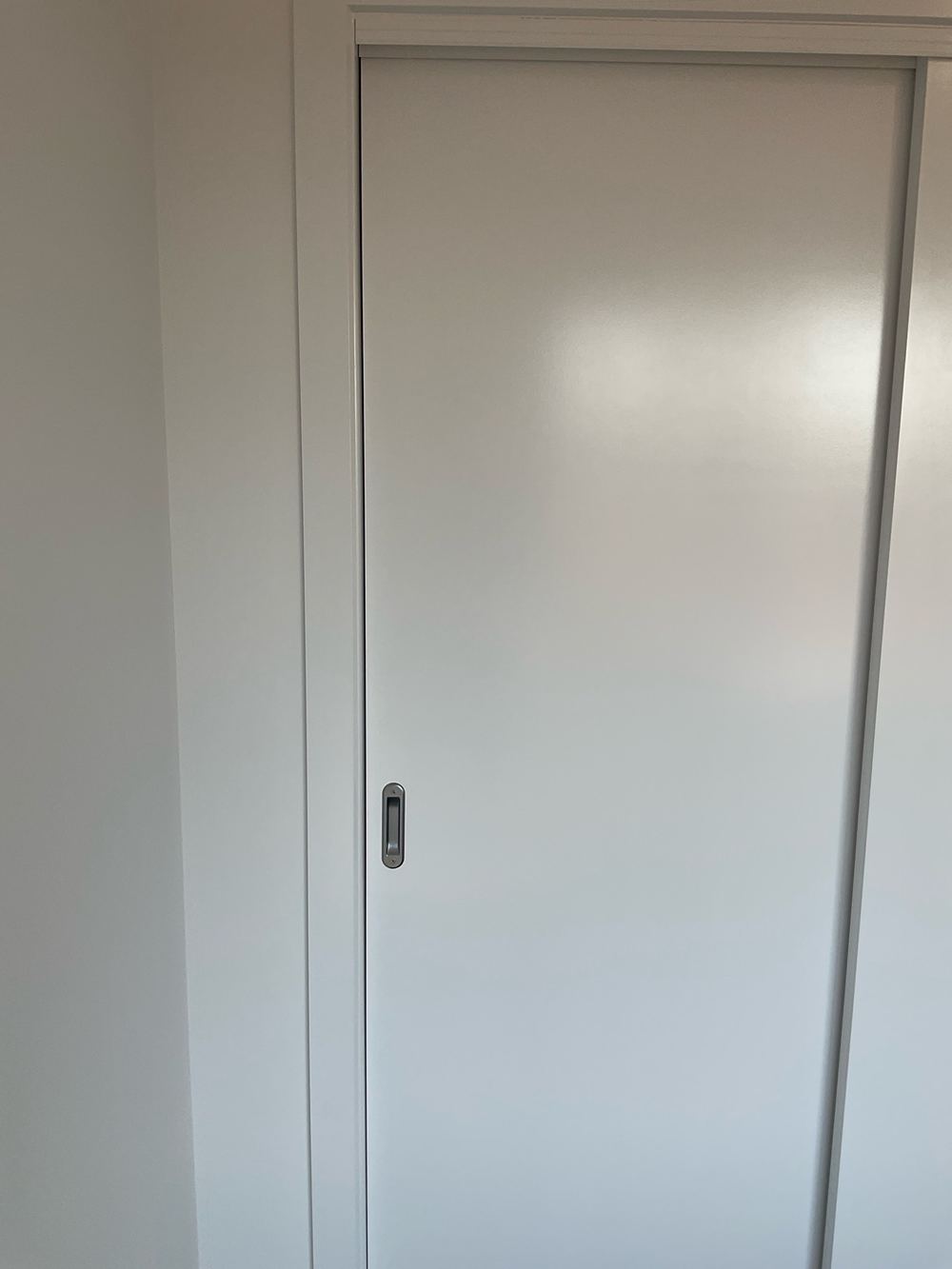 Door sitting proud of its frame instead of closing flush, found during a pre-handover inspection in Aintree