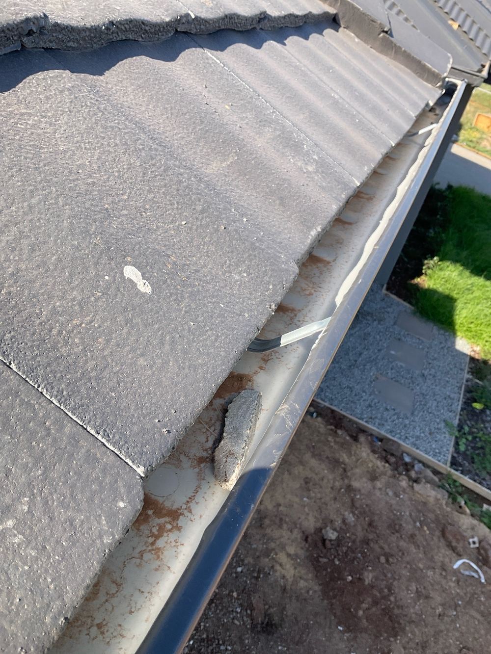 Debris still sitting in the gutters at handover, found during a pre-handover inspection in Aintree