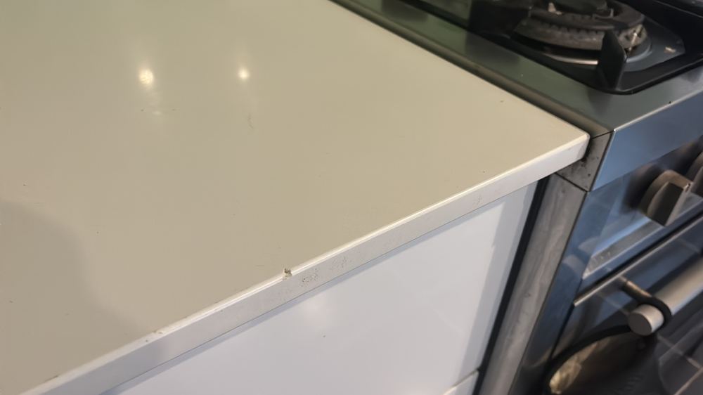 Damaged kitchen benchtop needing repair before a tenant moves in, found during a pre-purchase inspection in Braybrook
