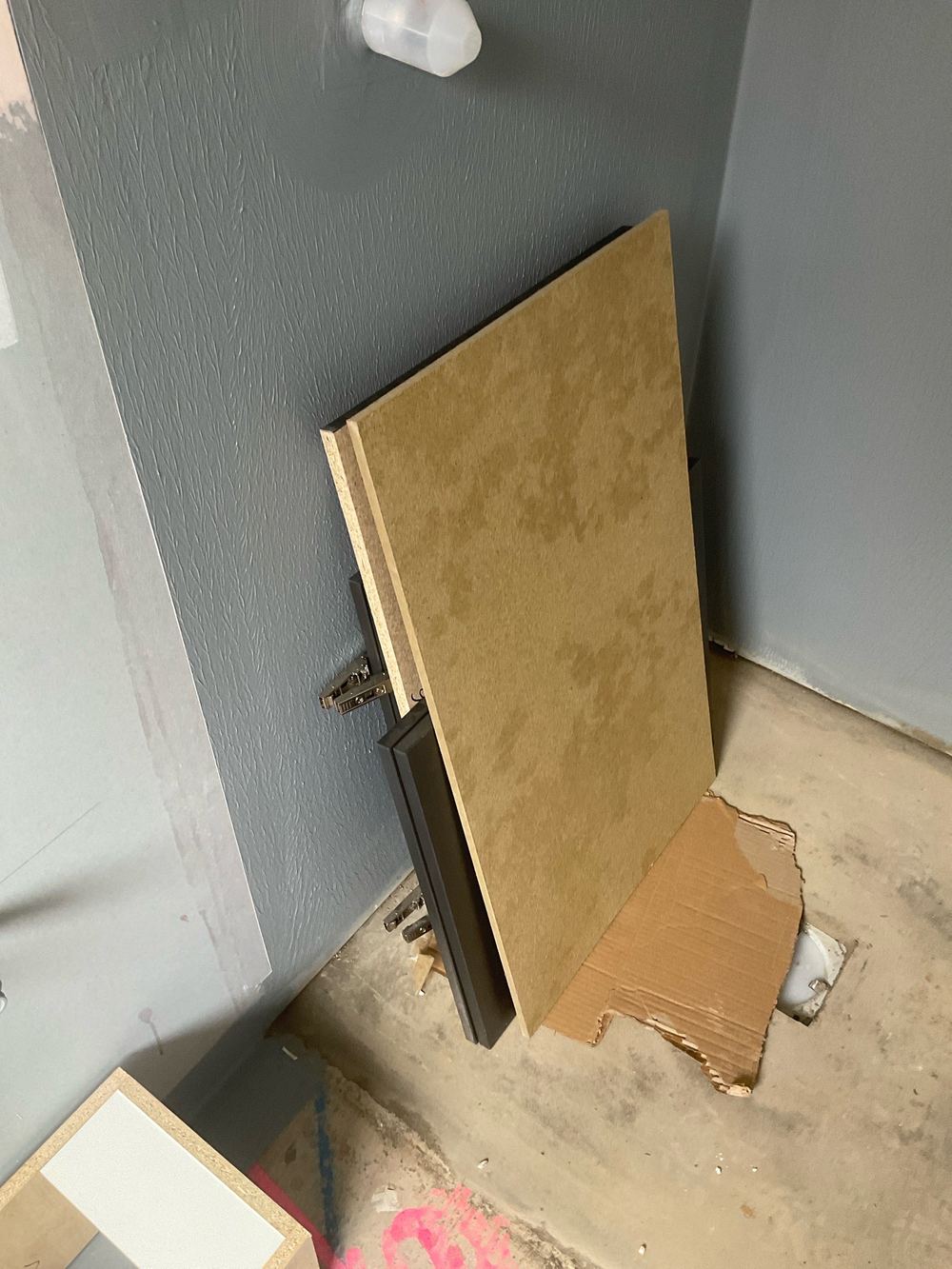 Finished membrane left unprotected while trades walk through the bathroom, found during a waterproofing inspection in Aintree